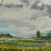 Painting. Landscape. Gray and blue sky, a meadow with wildflowers and grasses, bushes and trees in the distance.